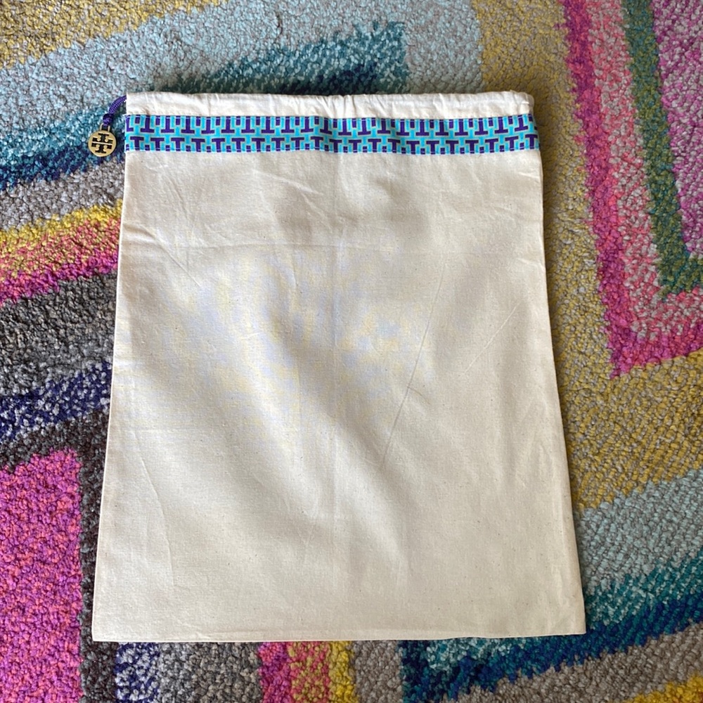 Tory Burch drawstring pouch with gold signature medallion